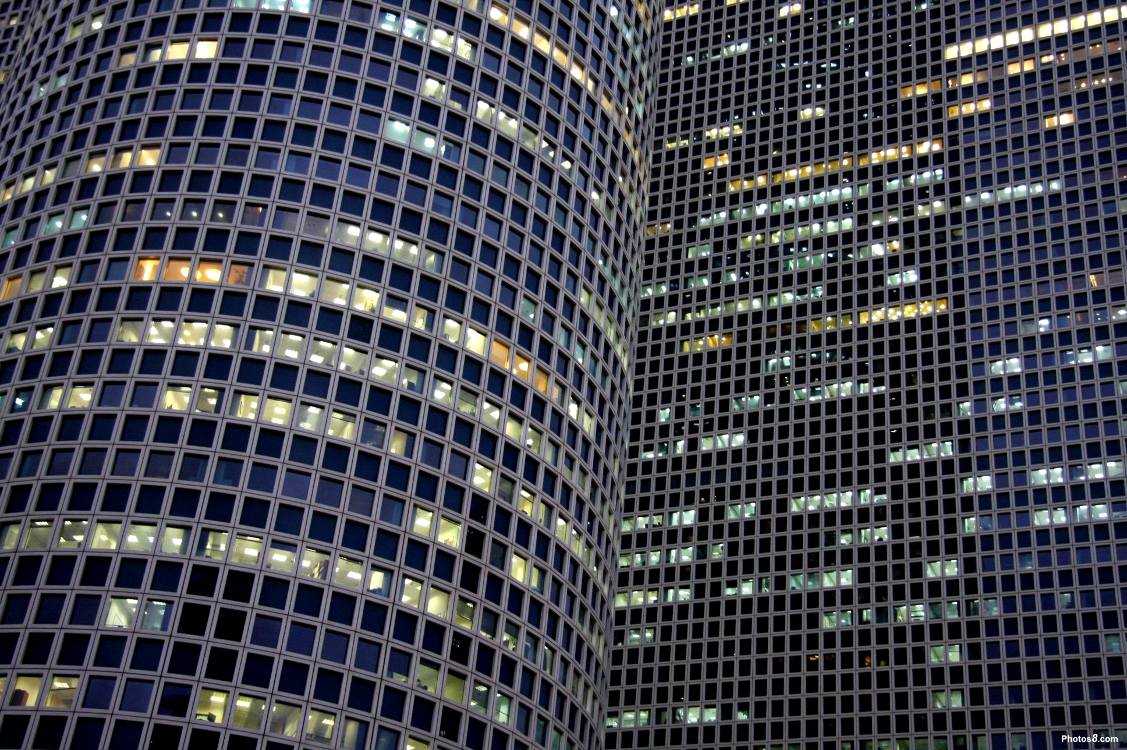 Click to get the codes for this image. Sky Scraper Lighted Windows, Cities  Buildings Background, wallpaper or texture for, Blogger, Wordpress, or any web page, blog, desktop or phone.