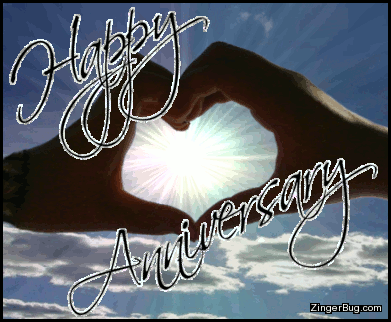 Click to get the codes for this image. This glitter greeting features two hands making a heart shape. Through the open heart you can see a glittering starburst sun and a blue sky. The comment reads: Happy Anniversary
